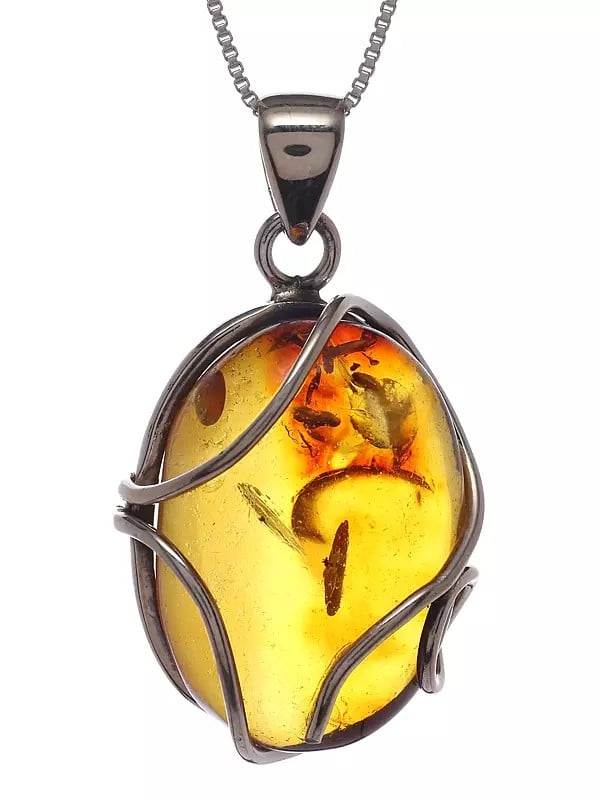 Exotic India Sterling Silver Wire Wrapped Baltic Amber Pendant 