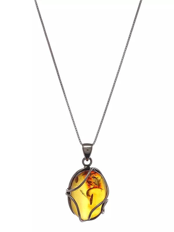 Exotic India Sterling Silver Wire Wrapped Baltic Amber Pendant 