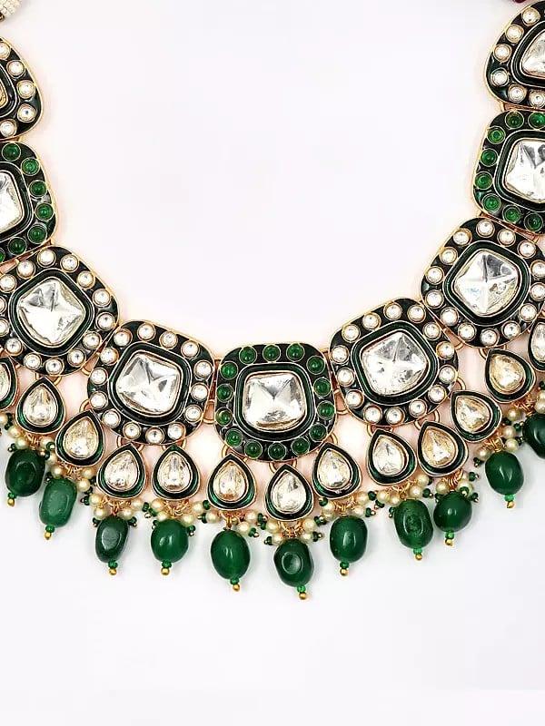 Exotic India Stone And Kundan Studded Jewelry Set With Green Beads Drop