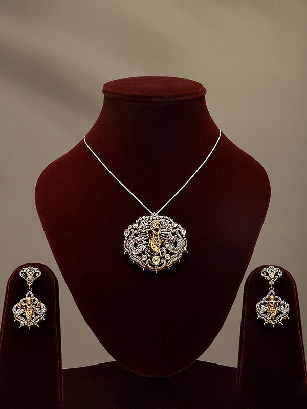 exotic india Stone and Kundan Studded Lord Krishna Pendant Set with Earrings 