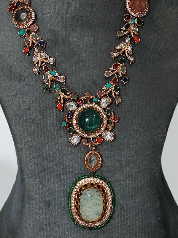 Exotic India Stone Floral Design Long Studded Necklace Set With Earrings