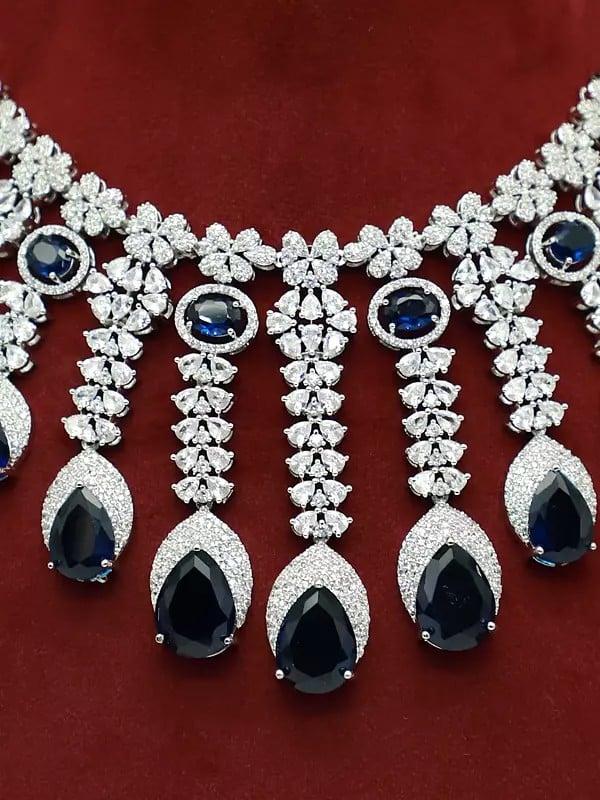 Exotic India Stone Studded American Diamond Attractive Necklace With Matching Earrings