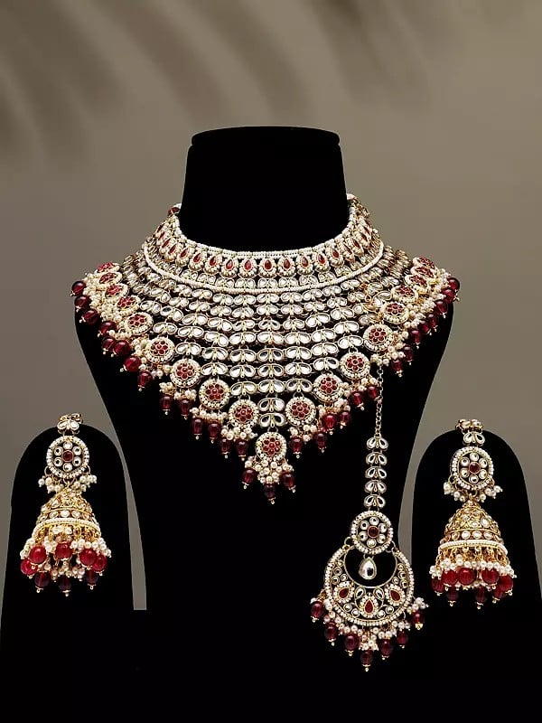 exotic india Stone Studded and Beaded Choker Necklace Set with Mangtika and Earrings with Chain 