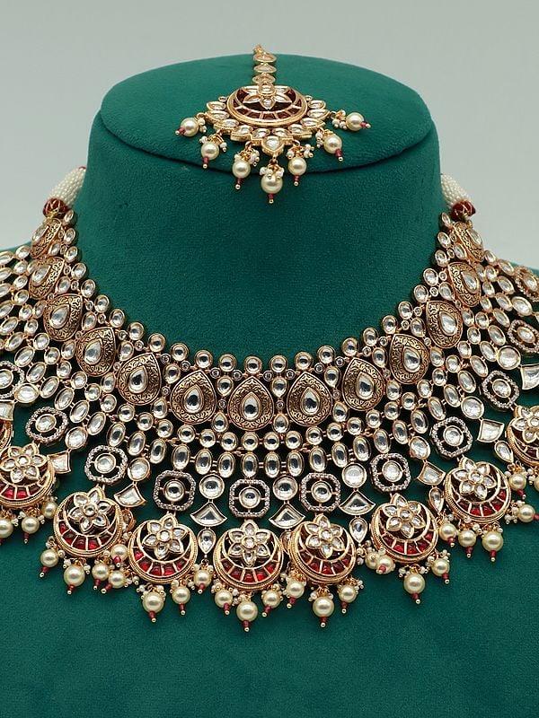 Exotic India Stone Studded And Beaded Heavy Necklace Set For Bride With Earrings And Mangtika 