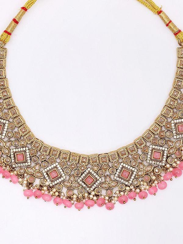 Exotic India Stone Studded And Beaded Necklace Set With Earrings And Mangtika 