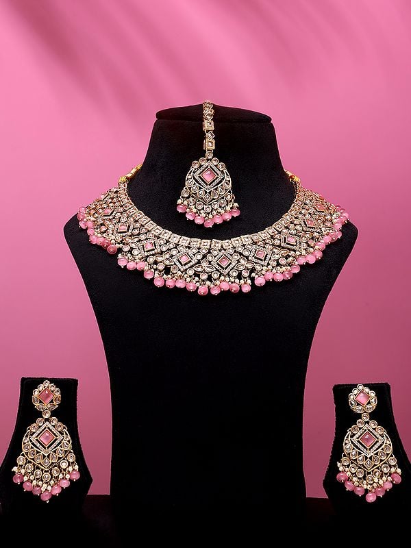 exotic india Stone Studded and Beaded Necklace Set with Earrings and Mangtika 