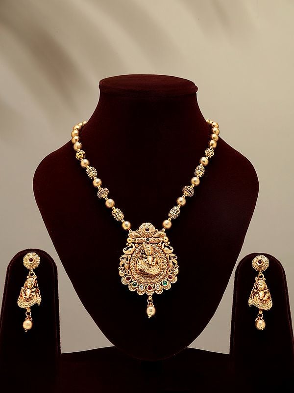 exotic india Stone Studded Bal Krishna with Cow Necklace and Earrings Set 