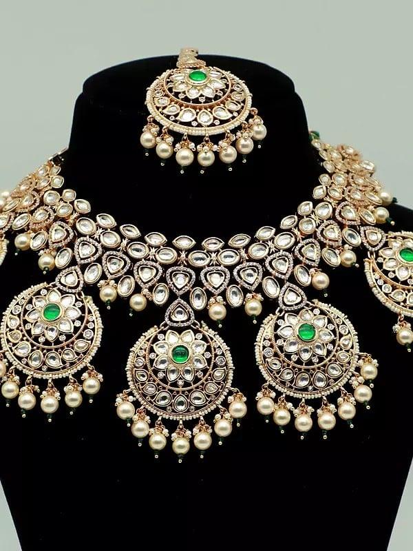 Exotic India Stone Studded Brass Heavy Necklace Set With Earrings And Mangtika