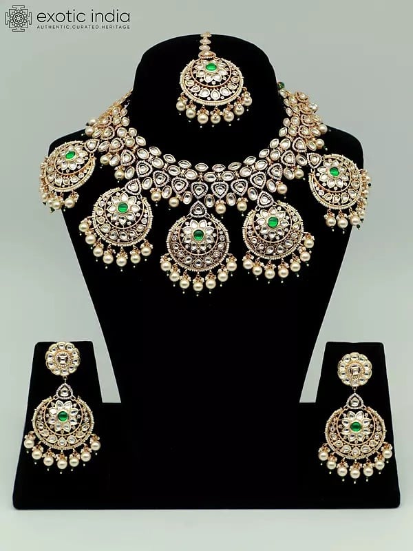 exotic india Stone Studded Brass Heavy Necklace Set With Earrings And Mangtika 