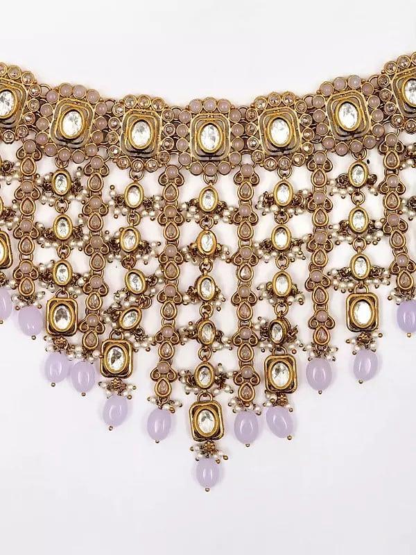 Exotic India Stone Studded Choker Necklace Set With Earrings And Mangtika 