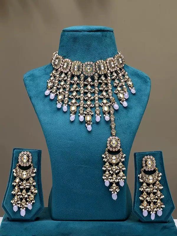 exotic india Stone Studded Choker Necklace Set with Earrings and Mangtika 