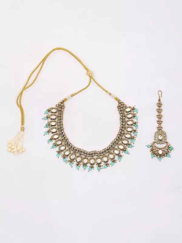 Exotic India Stone Studded Necklace With Earrings And Mangtika Set With Beads Drop
