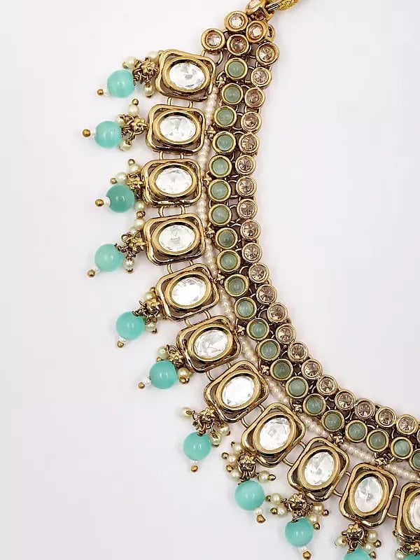 Exotic India Stone Studded Necklace With Earrings And Mangtika Set With Beads Drop