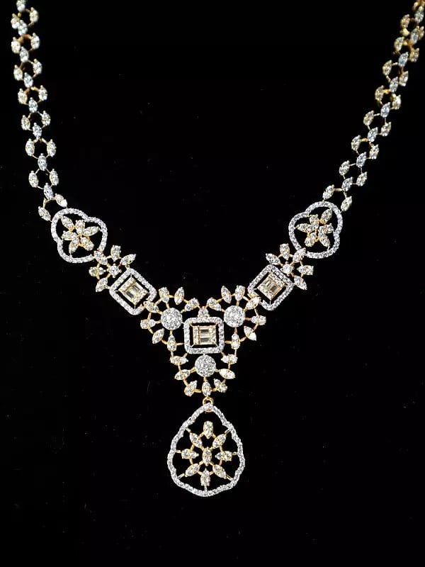Exotic India Stunning Floral Design Stone Studded American Diamond Necklace Set With Earrings