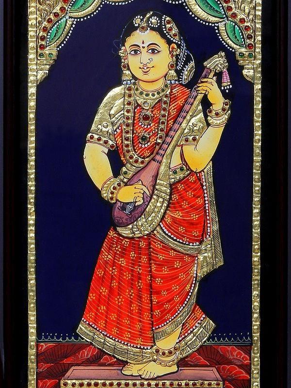 Exotic India Tanjore Painting Of Female Musician With Veena | Traditional Colors With 24 Karat Gold | With Frame