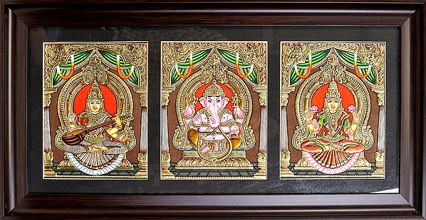 exotic india The Holy Trinity of Saraswati Ganesha and Lakshmi Ji - Framed Tanjore Painting 