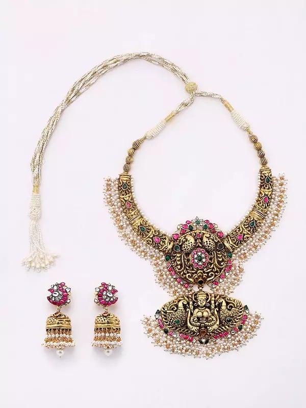 exotic india Traditional South Indian Temple Goddess Laxmi Embossed Patterns Necklace and Earrings Set 