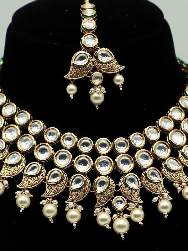 Exotic India Triple Layered Brass Necklace Set With Hanging Beads And Earrings