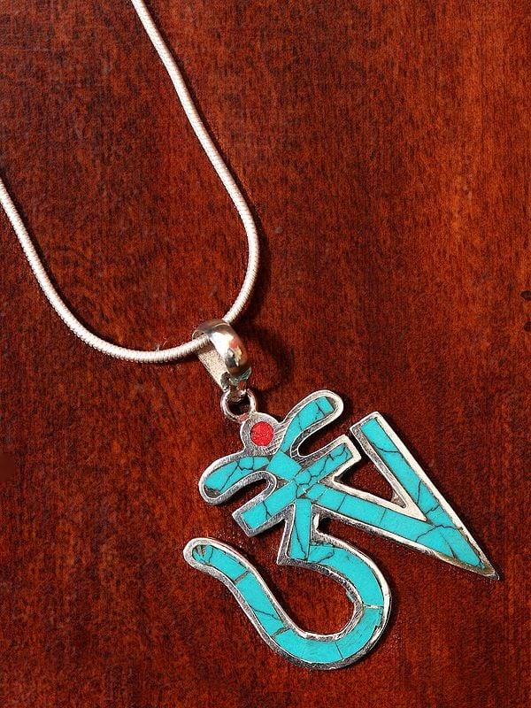 exotic india Turquoise Colored Tibetan Om (AUM) Inlay Pendant from Nepal 