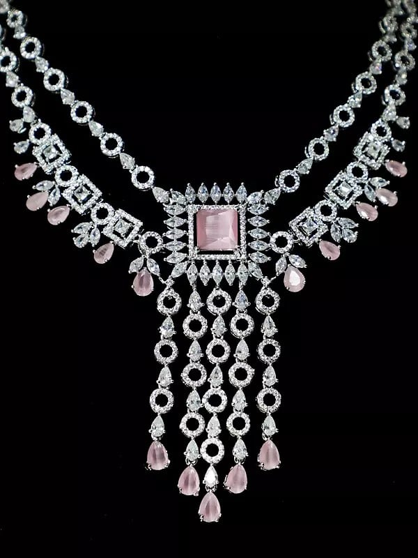 Exotic India Two Layered Stone Studded American Diamond Necklace Set With Earrings 