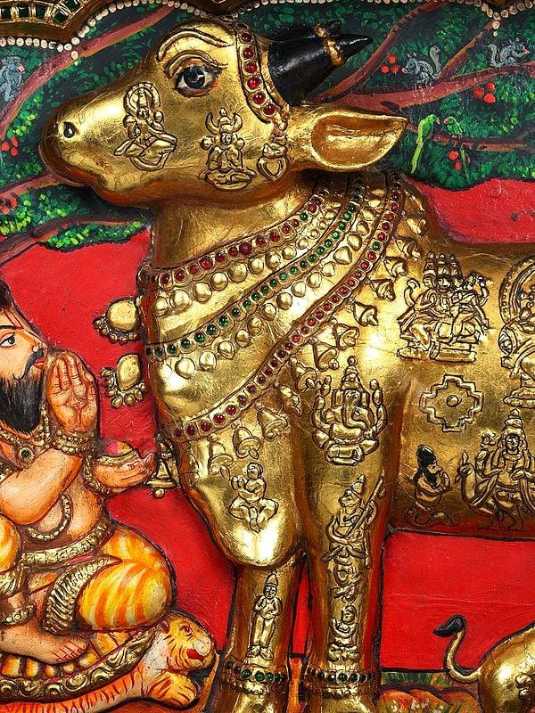 Exotic India Vashista Muni Worshipping Goddess Kamadhenu | Embossed 24 Karat Gold Work | Vintage Framed Tanjore Painting 
