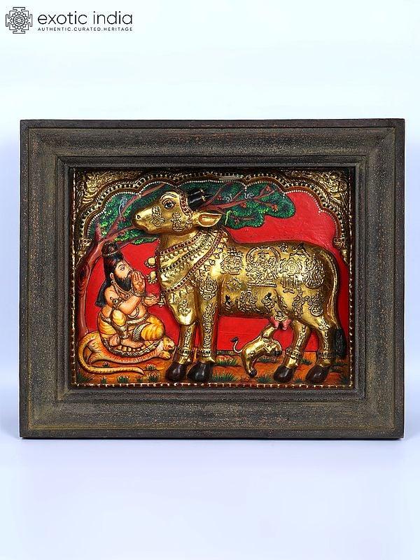 exotic india Vashista Muni Worshipping Goddess Kamadhenu | Embossed 24 Karat Gold Work | Vintage Framed Tanjore Painting