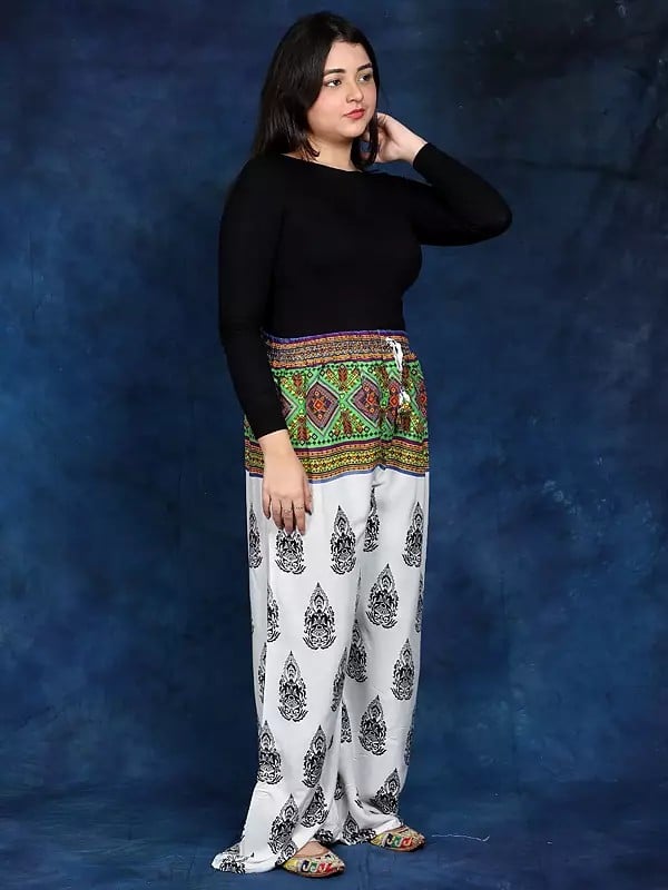 Exotic India White Bohemian Yoga Trousers With Gautam Buddha Print 
