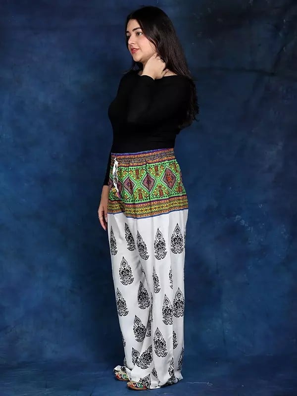 Exotic India White Bohemian Yoga Trousers With Gautam Buddha Print 