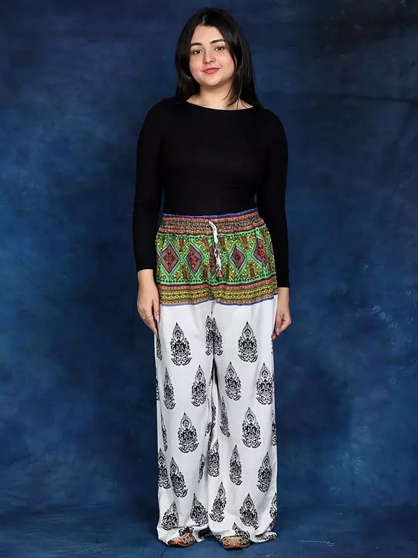 exotic india White Bohemian Yoga Trousers with Gautam Buddha Print