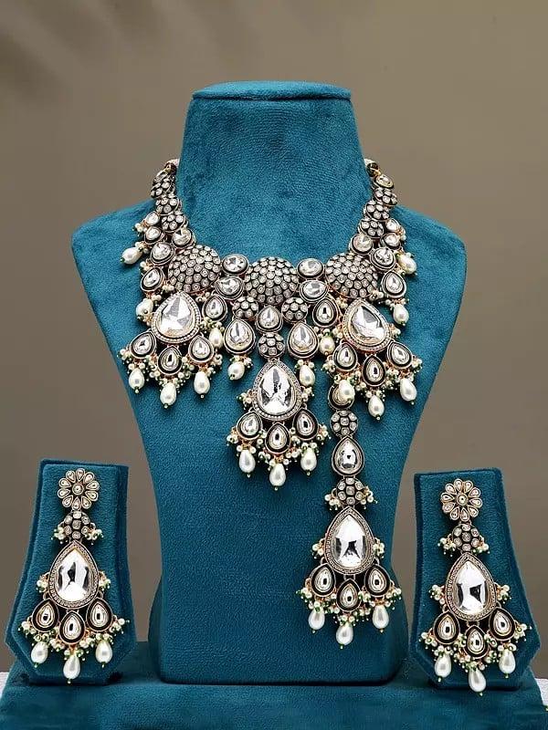 exotic india White Kundan and Cluster Beads Necklace Set with Earrings and Mangtika 