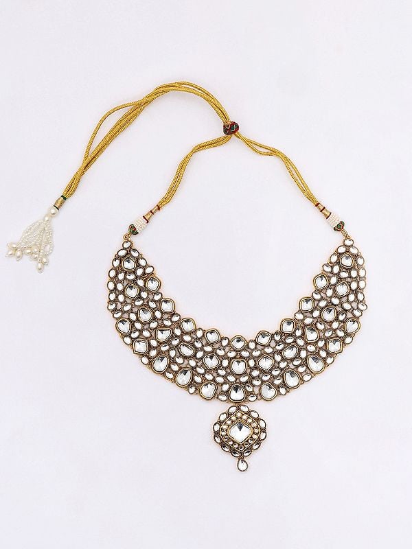 Exotic India White Kundan Studded Necklace With Earrings And Mangtika Set
