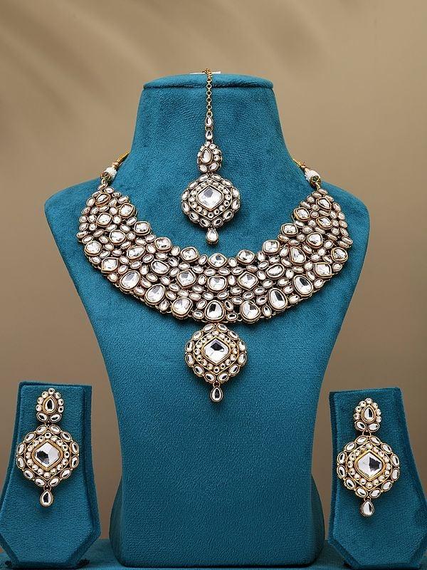 exotic india White Kundan Studded Necklace with Earrings and Mangtika Set 