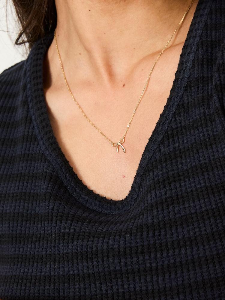 Fat Face Gold Tone Bow Pendant Necklace