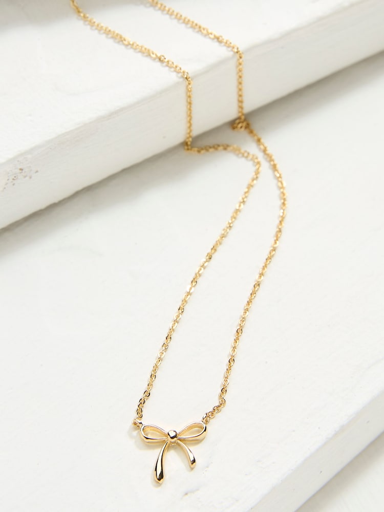 fat face Gold Tone Bow Pendant Necklace