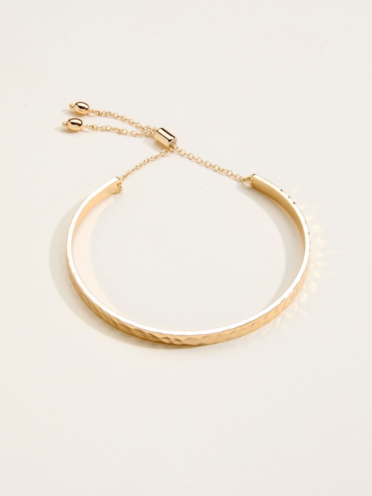 Fat Face Gold Tone Hammered Bangle