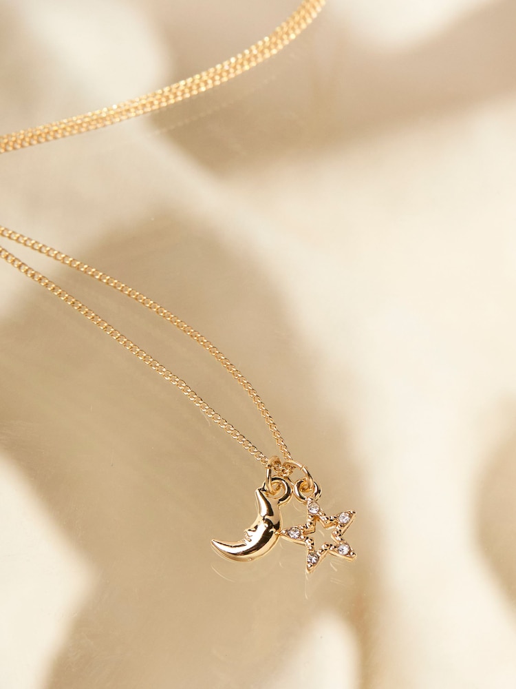fat face Gold Tone Star and Moon Necklace
