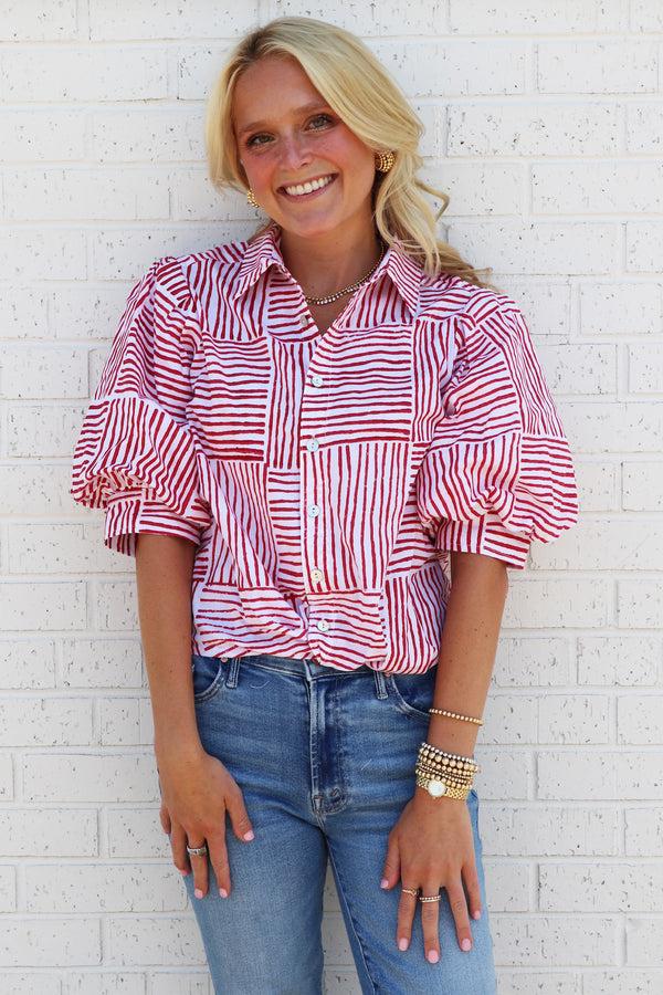 finley MENDED Bomba Red block stripe print blouse with a front-twist hem and short blouson sleeves