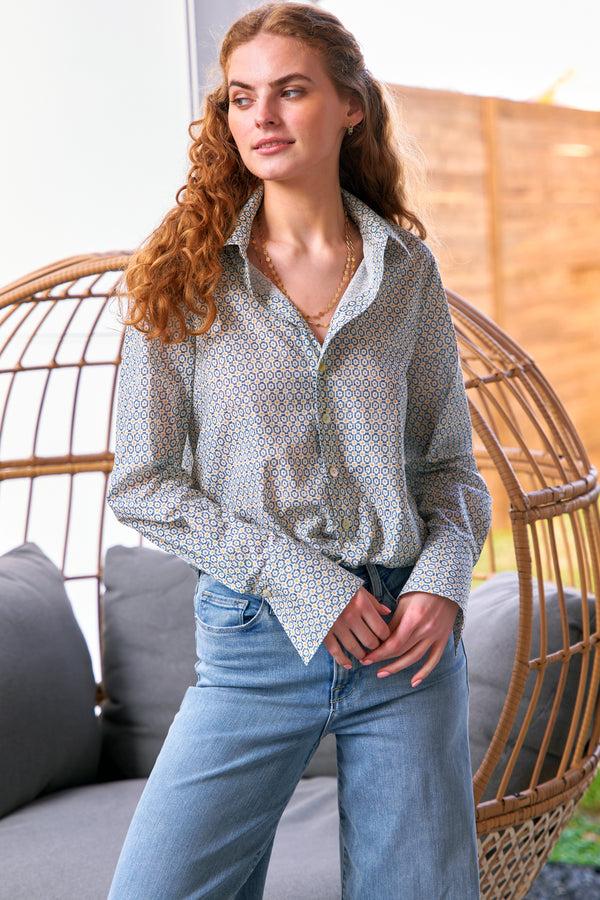 finley Moxie Cotton poplin blouse with a front-twist hem in a teal blue geometric print print