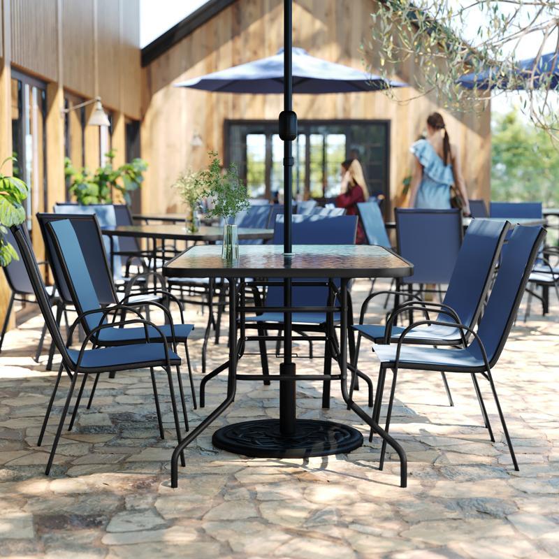 flash furniture Brazos 7 Piece Outdoor Patio Dining Set - 55" Tempered Glass Patio Table with Umbrella Hole 6 Navy Flex Comfort Stack Chairs
