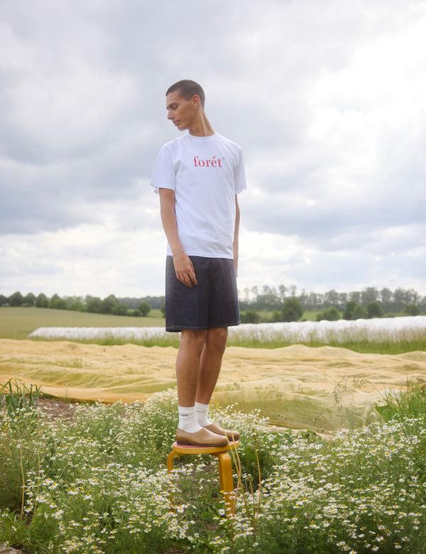 Forét CLAY CREASED DENIM SHORTS - DARK DENIM