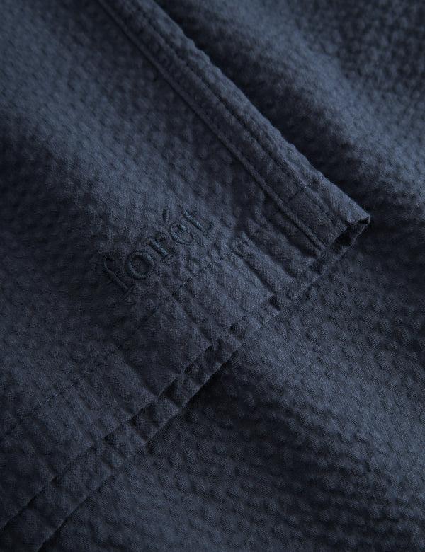 Forét HUSH SEERSUCKER SHORTS - NAVY
