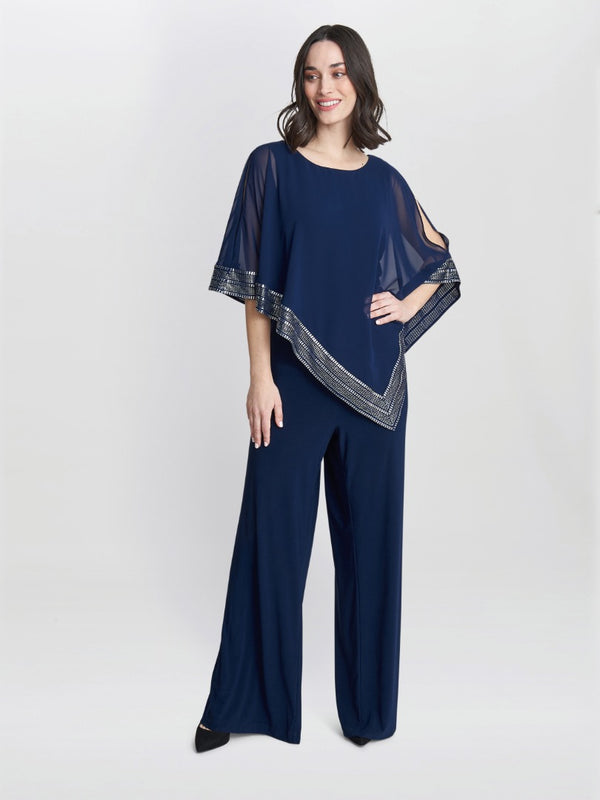 gina bacconi Eve asymmetrical cape jumpsuit with foil trim