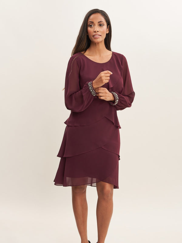 gina bacconi Sakura long sleeved tiered dress with rhinestone beading at cuff