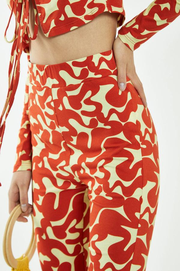 Glamorous Banana-Orange Squiggle Jersey Flared Trousers