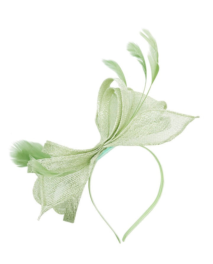 goddiva Bow Shaped Fascinator With Sinamay Curls & Feathers In Pastel Green by SVNX
