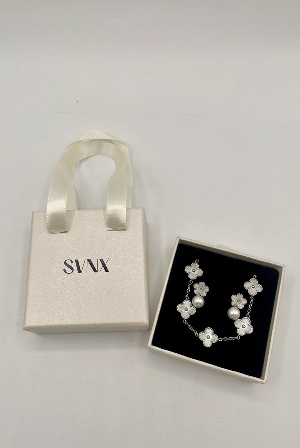 Goddiva Clover Bracelet & Earrings With Pearl Detail In Silver By SVNX