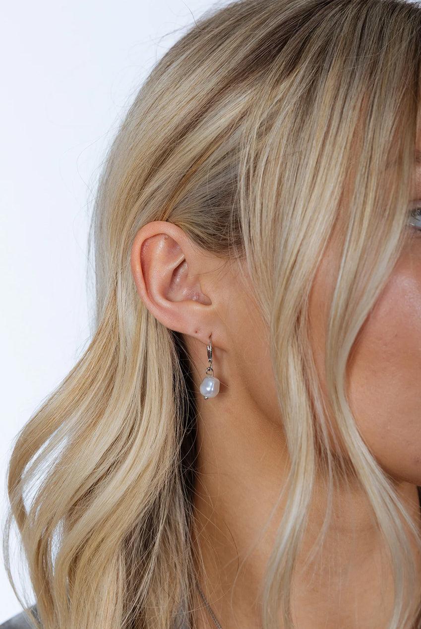 goddiva Baroque Pearl Earrings In Silver by SVNX