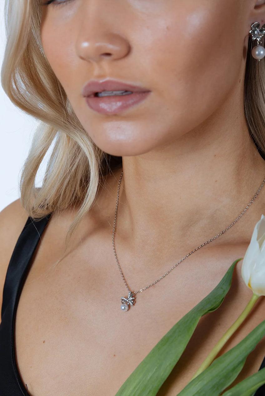 goddiva Dainty Bow Pearl Pendant Necklace by SVNX
