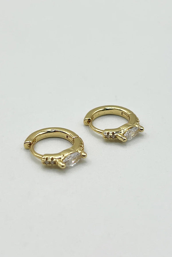 Goddiva Oval Crystal Huggie Hoops By SVNX