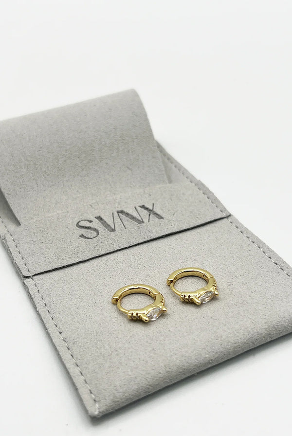 Goddiva Oval Crystal Huggie Hoops By SVNX